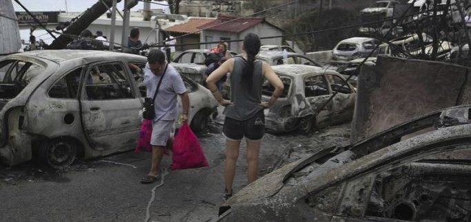 Жертвите на пожарите в Гърция нараснаха до 91